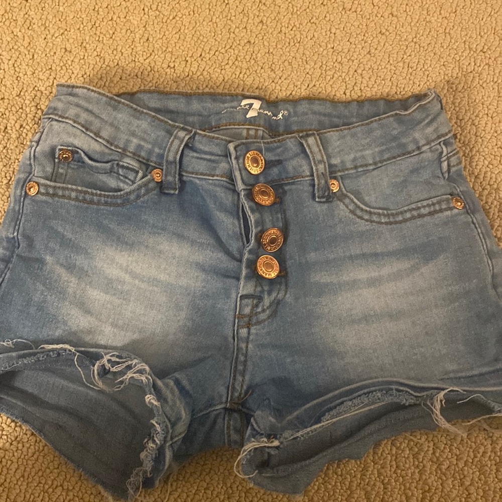 Girls Gently used Distressed jean shorts.